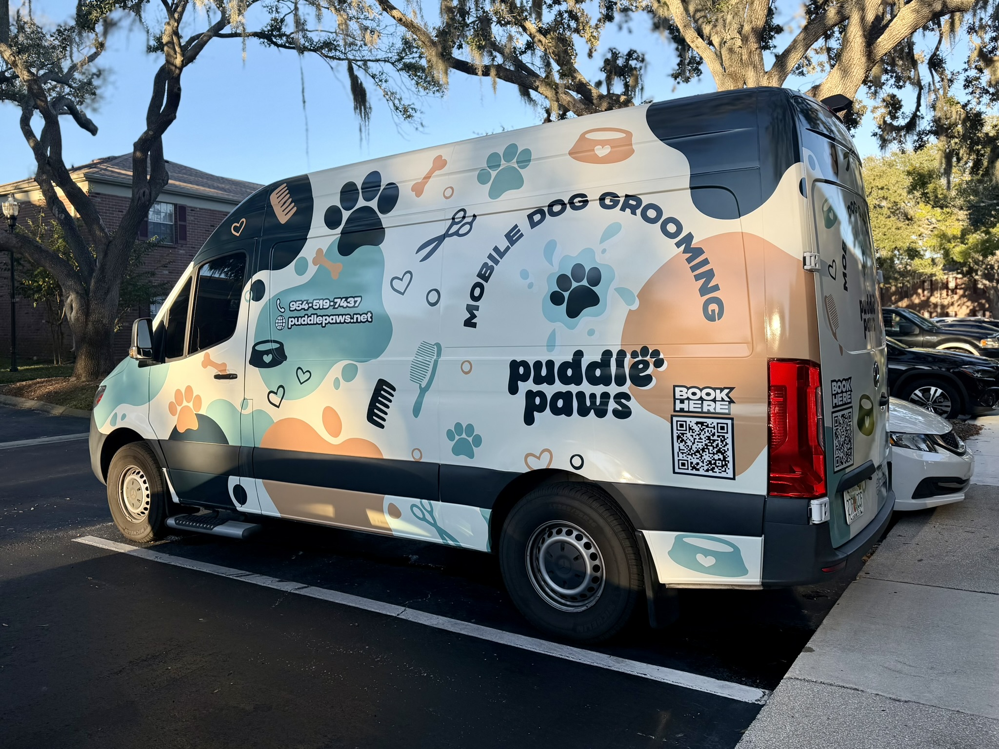 professional and fun dog grooming van parked in tampa florida
